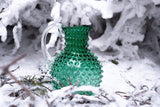 Underlay Dark Green Hobnail Jug in a snowy forest