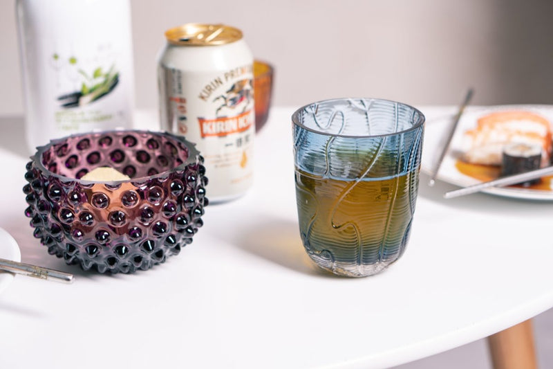 Violet Hobnail Bowl Small on a white table surrounded by a dinner