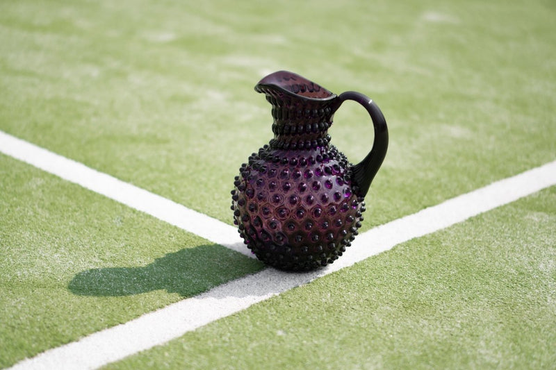 Violet Hobnail Jug on a tennis court 