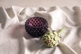 Violet Hobnail Bowl Small on a girs fabric with an artichoke 